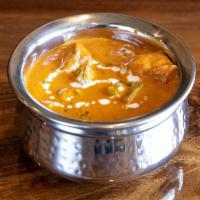 CHICKEN TIKKA MASALA · Boneless chicken cooked with roasted spices, onions, tomatoes and cream, with a touch of fen...