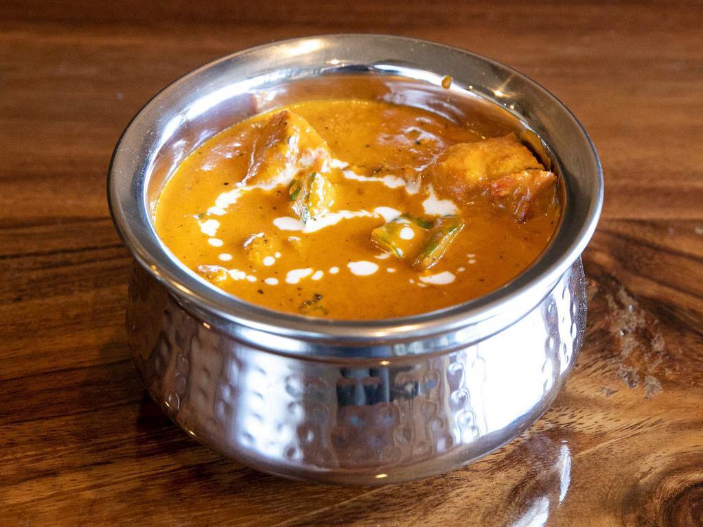 CHICKEN TIKKA MASALA · Boneless chicken cooked with roasted spices, onions, tomatoes and cream, with a touch of fenugreek. Gluten free.