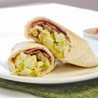 Breakfast Burrito · Choice of meat: bacon, sausage, or ham, egg, potatoes, peppers, cheese. Choice of creamy jal...
