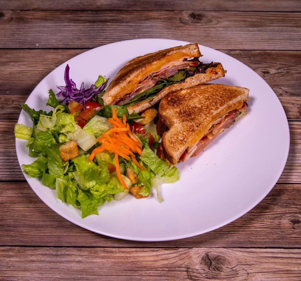 Southwest Turkey Club Sandwich · Turkey, wheat bread, bacon, Jack cheese, lettuce, tomato, and chipotle mayo.