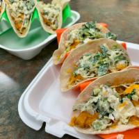 Paneer Tikka Tacos · 3 corn tortillas filled with buttermilk marinated paneer on a bed of cumin rice topped with ...