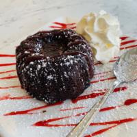 Chocolate Molten Cake · Warm chocolate cake,  ganache center  & strawberry sauce