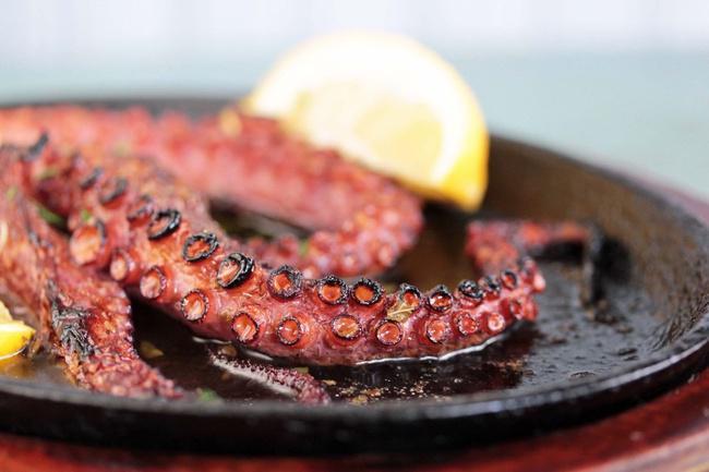 Wood Fired Octopus · Fresh Octopus cooked off in the pizza oven with balsamic vinaigrette (GF)