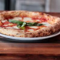 Margherita D.O.C · Italian tomato sauce, mozzarella di bufala, grana Padano and basil