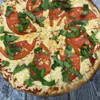 Vegan Margherita Pizza · Olive Oil, Pizza Sauce, Vegan Mozzarella, Vegan Parmesan cheese, Garlic, Sliced Tomatoes and...