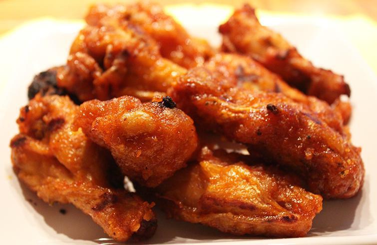 Buffalo Chicken Wings · Glazed in a delectable buffalo hot sauce, served with your choice of ranch of bleu cheese dressing.