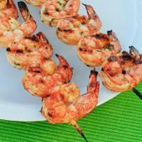 Grilled Shrimp on Skewers · Seasoned, charbroil grilled shrimp on skewers, toped with fresh cilantro. Served with slice ...