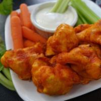 Cauliflower Buffalo Hot Wings · Vegan and Gluten Free, Comes with celery sticks and carrots, choice of dipping sauce.
