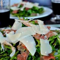 Arugula Prosciutto Salad · Organic Baby Arugula, Prosciutto, Shaved Parmesan and with your choice of salad dressing on ...