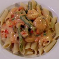 Penne with Shrimp · Penne with shrimp, sun-dried tomatoes, asparagus, roasted red peppers in tomato basil sauce.