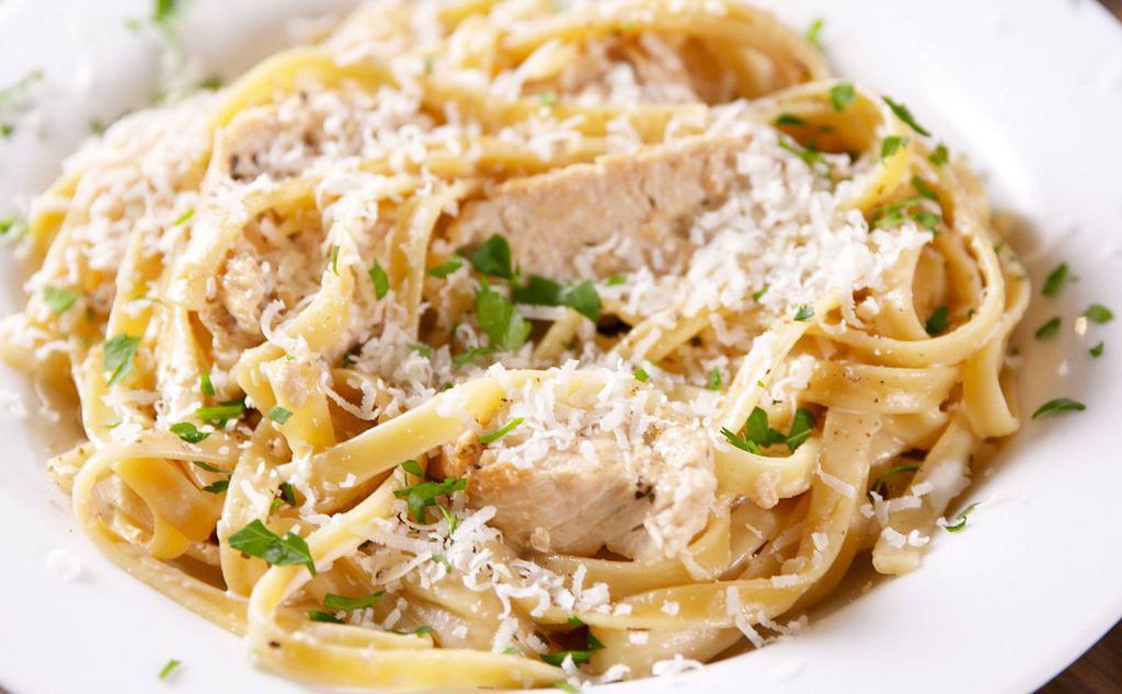 Fettuccini Chicken Alfredo · Served with Garlic Cheese Bread