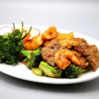 Triple Delight · Jumbo shrimp, sliced chicken breast and beef sauteed with mixed vegetables.