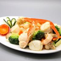 Seafood Delight · Jumbo shrimp, snow crab meat and scallop sauteed with variety of vegetables in white wine sa...