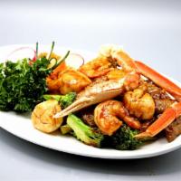 Happy Family · Combination of jumbo shrimp, scallops, tender beef, crab meat and sliced chicken breast, sau...