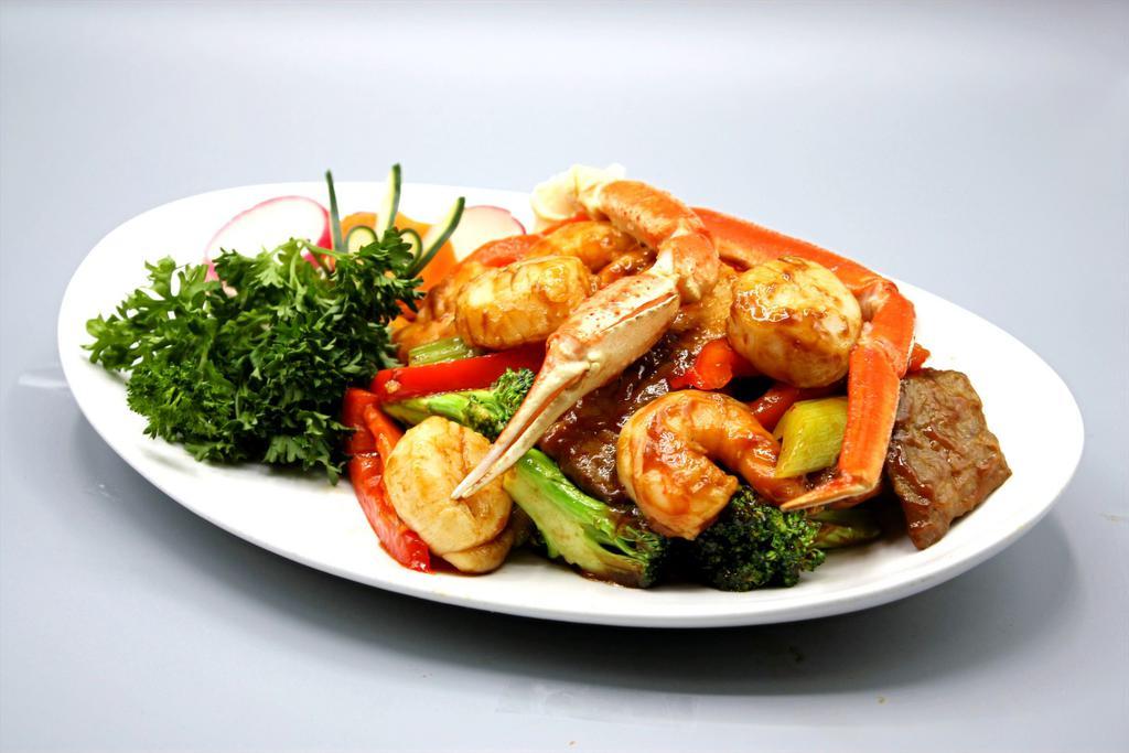 Thai Basil Seafood · Jumbo shrimp, scallop with broccoli, onion, sweet bell pepper in Thai basil sauce. Hot and spicy.