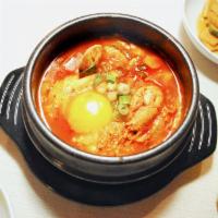 Soft Tofu Soup 순두부 · Spicy tofu soup made with freshly curdled soft tofu, mushrooms, onion, and red chili paste s...
