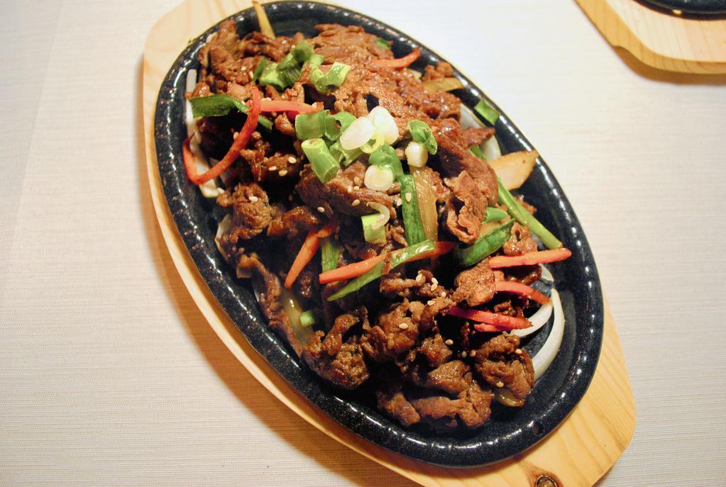 Spicy BBQ Pork 돼지불고기 · Pork tenderloin marinated in spicy sauce.