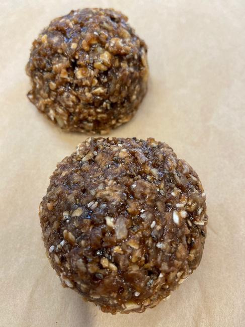 Energy Bites (GF/V) - 2 · 2 Homemade Energy Bites (Ingredients)- Popped Rice, Oats, Chia, Chocolate Organic Protein Powder, Walnuts, Peanut Butter, Brown Sugar, almond milk and Coconut butter.