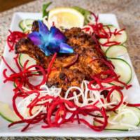 Mughlai Chicken Chop · Chicken thighs marinated in chef's special blend of spices.