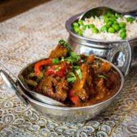 Goat Bhuna · Delicious, slow simmered, juicy goat enrobed in flavorful sauce.
