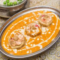 Mughlai Dum Aloo · Slow-cooked potatoes stuffed with cottage cheese, mixed veggies, Cajun nuts and seasoned wit...