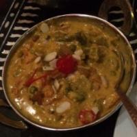 Navrattan Korma · Assorted vegetables in rich Mughlai sauce with nuts and dry fruits.