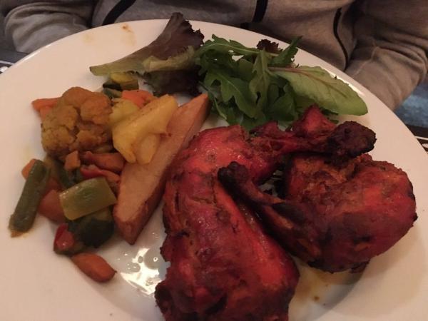 Tandoori Chicken · Roasted chicken prepared with yogurt and spices in a clay oven.