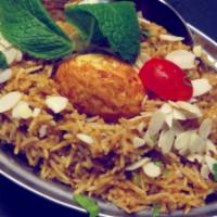 Mughlai Special Dum Biryani · Flavorful chicken, lamb, goat, chicken, shrimp and egg slow simmered with basmati rice and w...