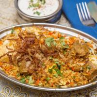 Goat Biryani · Succulent goat, slow-simmered with basmati rice and whole spices.