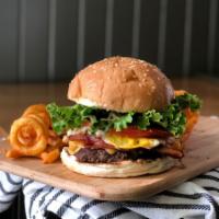 Texas Burger · 8 oz. hamburger, bacon, American cheese, lettuce, tomato, fried egg and BBQ sauce.