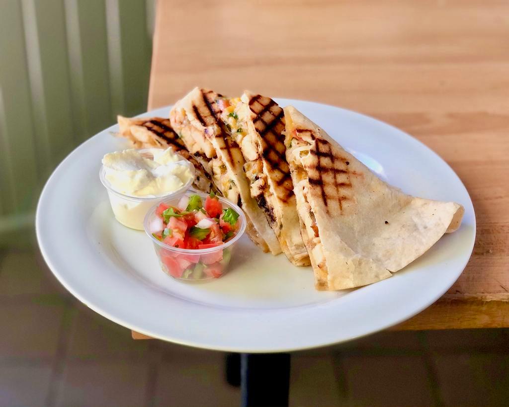 Quesadilla · Classic Mexican and Tex Mex cheese quesadilla! Toasted flour tortilla with melted cheese inside.