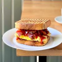 Bacon on Texas Toast · Scrambled eggs, American cheese and ketchup.