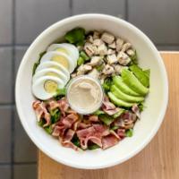 Classic Cobb Salad · Grilled chicken breast, chopped bacon, avocado and hard-boiled egg over lettuce.