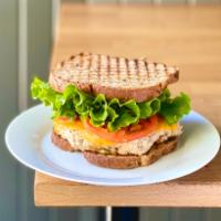 Tuna Melt Sandwich · Fresh tuna salad, cheddar cheese, lettuce and tomato on multigrain.