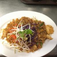 95. Pad Thai · Rice noodles with ground peanut, egg, onion and bean sprout. Includes choice of either chick...