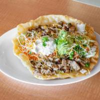 Taco Salad · Flour tortilla bowl filled with choice of grilled chicken or ground beef with beans, lettuce...