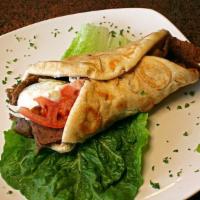 Gyros Supreme · Gyros served with feta cheese ,lettuce, tomatoes and onions w/Gyros Sauce 