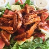 Large Buffalo Chicken Salad · Fried chicken in Buffalo sauce, romaine lettuce, tomatoes, onions, cucumbers, served with a ...