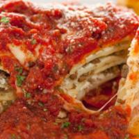 Cheese Lasagna with Meat Sauce · Lasagna topped with classic cheese, tomato sauce, and ground beef sauce.