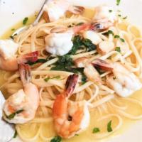 Shrimp Scampi · Over linguine.