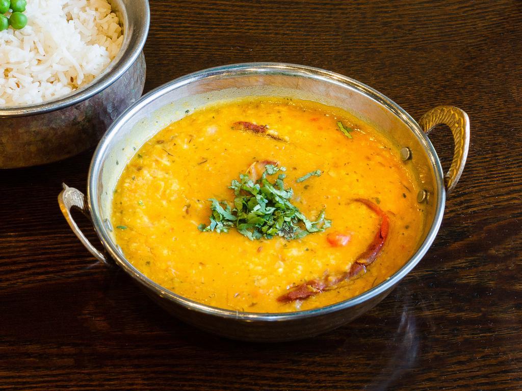 Dal Tadka · Simmered yellow lentils tempered with ginger, garlic and cumin. (Vegan)