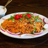 Shahi Chicken Biryani · Long grained basmati rice, cooked with succulent pieces of chicken and blended with exotic I...