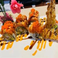 Angel Roll · Shrimp tempura, avocado, mango, on the side, spicy crab tobiko fish egg on the top wrap with...