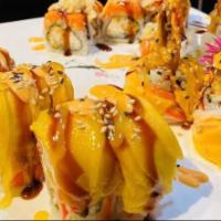 Golden Dragon Roll · Shrimp tempura, cheese inside, crab meat, mango top.