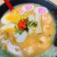 Seafood Ramen · Miso. Shrimp, squid, egg, fish cake, bamboo shoot, scallops, nori.