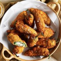 Jalapeño Poppers · Crunchy Jalapeño poppers filled with cream cheese served hot and tasty! 