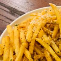 Truffle Fries · Tossed with truffle oil and grated parmesan and fresh parsley