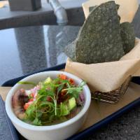 Peruvian Ceviche · Shrimp and market catch in Leche De Tigre marinade, avocado, cilantro, onion.  Served with b...