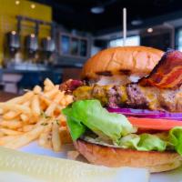 Ebullition Burger · A 1/2 lb patty, lettuce, red onion, tomato, house made spread, hand slice bacon on potato br...