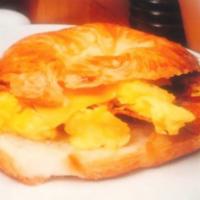 Bacon Eggs n’ Cheese croissant. · Thinly sliced smoked bacons with scrambled eggs and melted 5 cheese in a croissant.